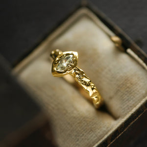 Gold ring presented on a vintage jewellery box